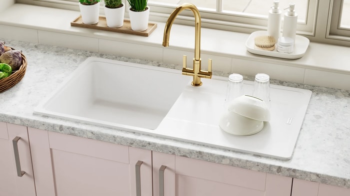 Sink and tap underneath the window in an Ohio Dusky Pink Kitchen