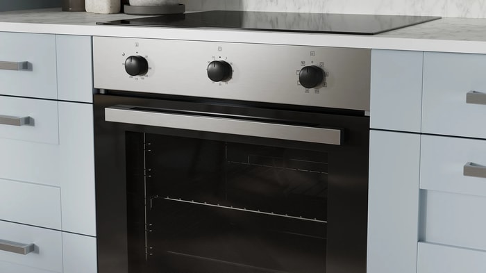 Integrated oven and induction hob in an Ohio Hazy Blue Kitchen
