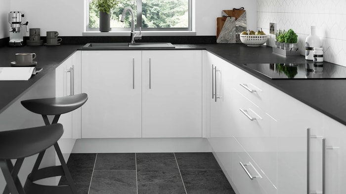 White Orlando Kitchen with sink and tap located underneath the window