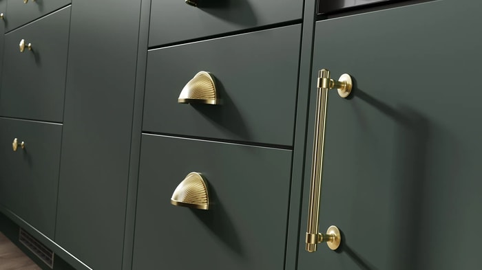 Handles on kitchen units in a Sandford Forest Green Kitchen