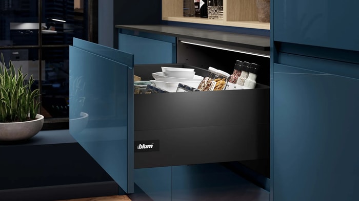 An open drawer in a Sofia Marine Blue Kitchen